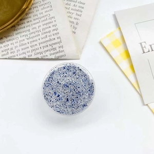 Round collapsible phone grip holder featuring blue and silver glitter flakes