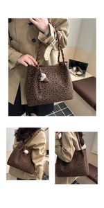 Detail of leopard print tote bag with woven handles and plush ice cream pendant
