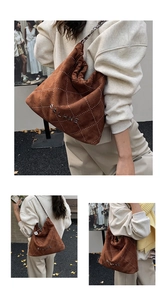 Detail of brown suede bucket bag featuring diamond stitching and metal chain strap