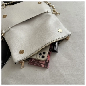 Detailed top view of white lychee pattern crossbody bag showing interior storage capacity