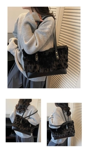 Detail of black plush faux fur tote bag with leather straps and metal rivets