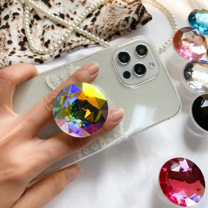 Close-up of sparkling crystal gemstone phone grip showing 3D multifaceted cutting design