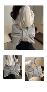 Detailed close-up of large 3D bow on nylon tote bag showing satin texture and craftsmanship