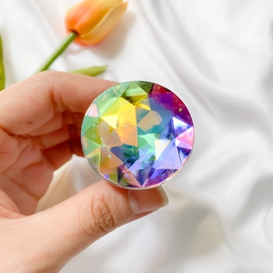 Close-up of a multifaceted candy-colored gem pop socket with rainbow light reflections
