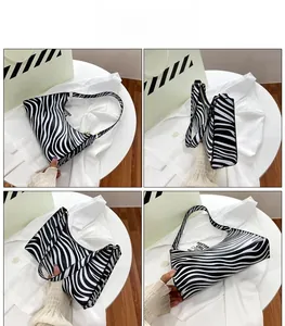 Detailed multi-angle views of zebra print baguette bag with black and white animal patterns