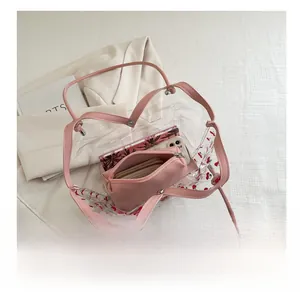 Top view of cherry print clear PVC tote bag showing large capacity with pink inner pouch