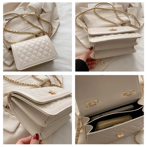 Detail view of cream quilted bag showing chain strap and multi-compartment interior