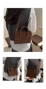 Leopard print crossbody bag with gold hardware and removable shoulder strap detail