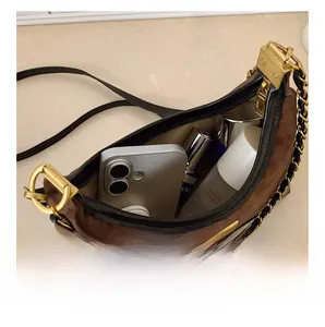 Internal view of leopard print shoulder bag showing large capacity for phone and cosmetics