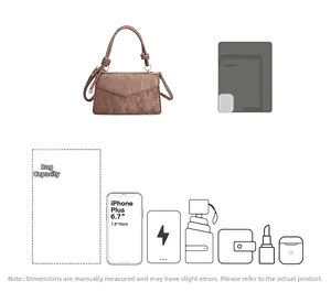 Detail view of large capacity brown leather crossbody bag showing items it can hold