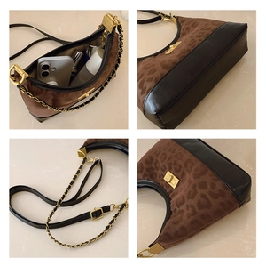 Detail view of leopard print crescent bag showing gold hardware and double strap texture