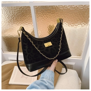 Detail of leopard print faux calf hair and leather crossbody bag with gold twist lock