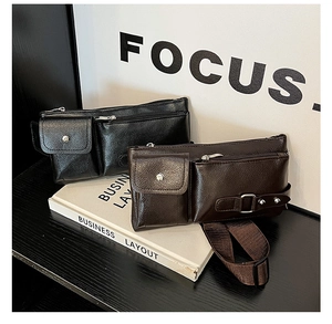 Detail of vintage faux leather chest bags in black and brown with textured finish