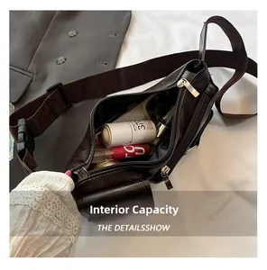 Macro view of inner storage capacity in a vintage brown leather crossbody bag