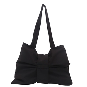Fashionable black bow-shaped shoulder bag with slim straps in a matte finish