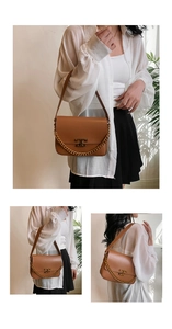 Close-up of brown leather bag with gold T-logo, chunky chain detail and side view