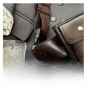 Detailed view of the dark brown lychee grain leather chest bag with premium metal buckle