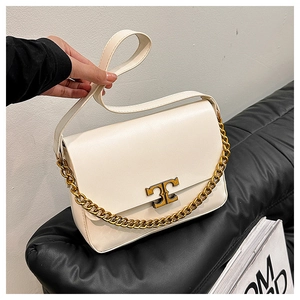 Chic cream leather crossbody bag with gold chain and T-shaped metal clasp detail