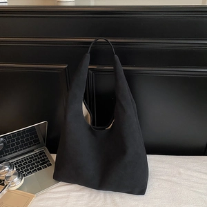 Minimalist large black canvas tote bag with contrast lining for daily commute and study