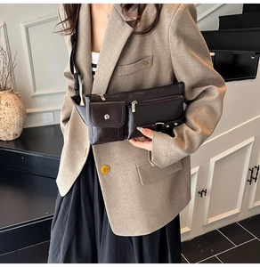 Close-up of retro brown leather crossbody bag with multi-pocket functional design