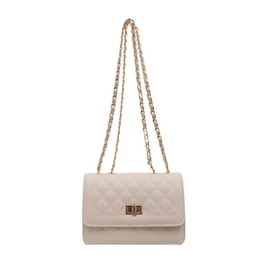 Elegant cream quilted crossbody bag with gold chain strap and rectangular turn-lock closure