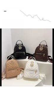 Detail of four mini chevron quilted backpacks in black, coffee, beige, and white colors