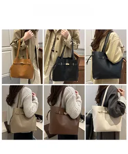 Detail view of large leather tote bags in five colors with metal buckle and drawstring side