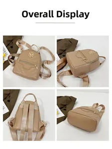 Detail view of khaki mini backpack with V-shaped quilting and gold metal M logo