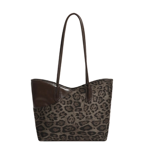 Leopard print tote bag with dark brown leather straps and large capacity for daily use