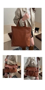 Detail showing the brown leather tote convertible to a fold-over crossbody bag