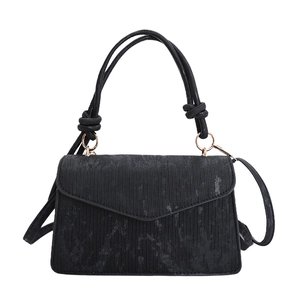 Fashionable black corduroy rectangular crossbody bag with gold hardware and knot detail handle