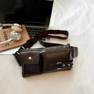 Street style dark brown textured leather chest bag with front pocket and adjustable strap