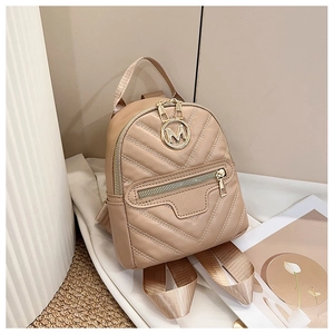 Detail view of quilted khaki PU leather bag featuring a round metallic M logo and zipper