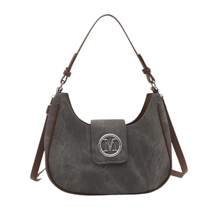 Minimalist dark gray canvas moon bag with brown leather trim and M-logo metal buckle