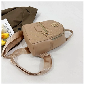 Detailed top view of light brown quilted mini backpack with gold logo on white background