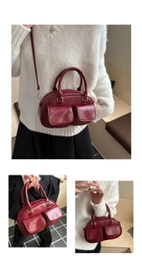 Detail view of burgundy PU leather handbag with front pockets and fashion print