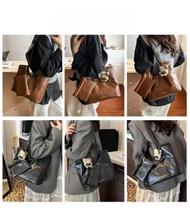 Detail showing high-capacity vintage leather tote bag set with a small hanging pouch