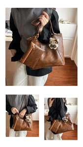 Detail view of brown vintage leather tote bag with matching coin purse and plush charm