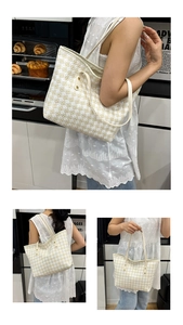 Detail of large woven tote bag with yellow checkered pattern and spacious interior