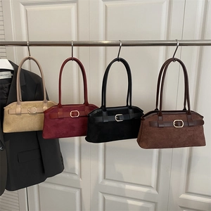 Vintage suede shoulder bags in four colors with decorative metal buckles and slim handles