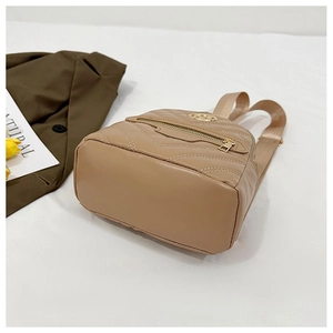 Detail of chevron quilted leather backpack in beige with gold metal logo and zipper