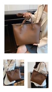 Macro detail of dark brown leather tote bag showing gold buckle and fine brand texture