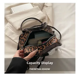 Interior view showing large capacity of the leopard print handbag with daily essentials
