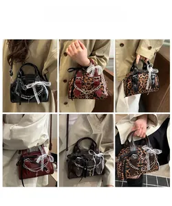 Lace bow shoulder bag with gothic chain and cross pendant shown on model in various styles