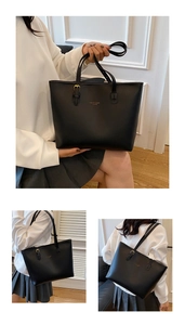 Detail view of large black tote bag featuring Amber & Bags Fashion text and adjustable strap