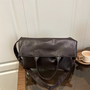 Vintage dark brown pebble grain tote bag with top handles and wide shoulder strap