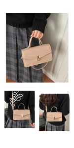 Detail of a beige leather crossbody bag featuring a gold metal lock and fine stitching