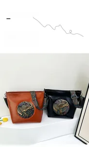 Detailed close-up of retro shoulder bags featuring ethnic elephant embossed pattern