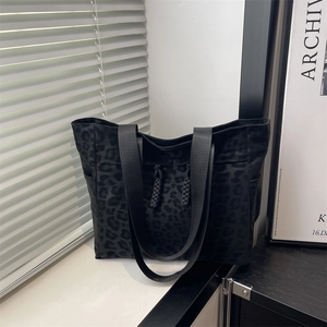 Chic black leopard print canvas tote bag with large capacity and wide shoulder strap