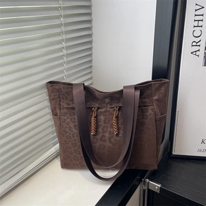 Minimalist leopard print canvas tote bag with woven tassels and large capacity